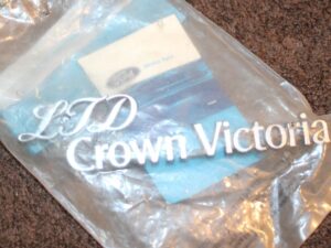 1983-1987 Ford LTD Crown Victoria NOS 'LTD CROWN VICTORIA' EMBLEM NAME PLATE