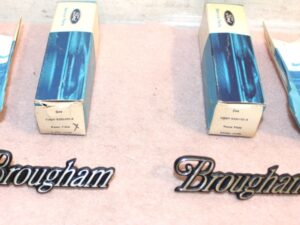 1973 1974 Marquis Brougham NOS 'BROUGHAM' ROOF PILLAR OUTSIDE EMBLEM NAME PLATES
