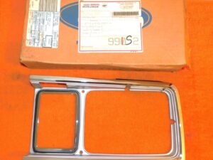 1979 1980 Ford Fairmont and Futura NOS LH FRONT HEAD LAMP DOOR Light Argent